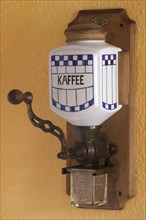 Wall mounted coffee mill