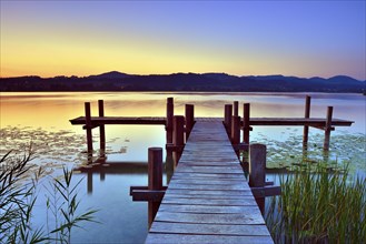 Wooden pier at sunrise on Pfaffikersee