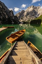 Stairs in mountain lake with boats