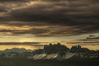 Sunrise with dramatic clouds over South Tyrolean mountain range