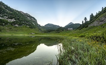 Karlingerhaus reflected in lake Funtensee