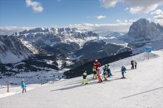 Children with ski instructor on the ski slope