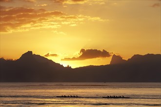 Sea kayaks on the sea at sunset