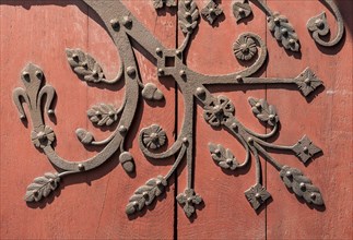 Ornate metal fittings on wooden door