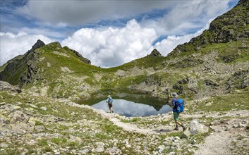 Hikers at small lakes in the Klafferkessel