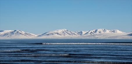 View from the peninsula Vatnsnes to sea and snow-capped mountains