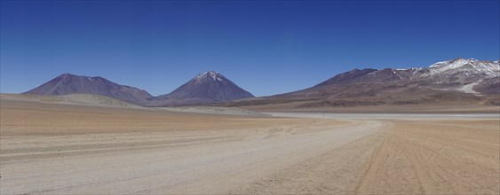 Runway on the Altiplano with volcano Licancabur