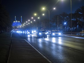Traffic in front of illuminated Mohammed Al Ameen Mosque