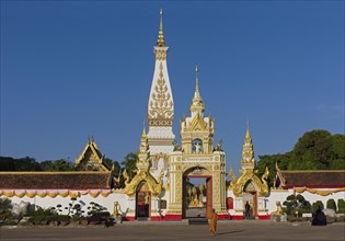 Monk in front of Chedi of Wat Phra That Phanom