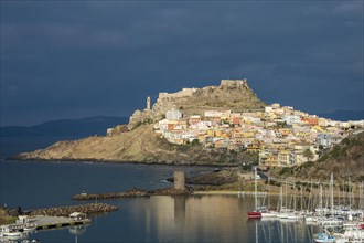 Dramatic light over the old town of Castelsardo with its boat harbour