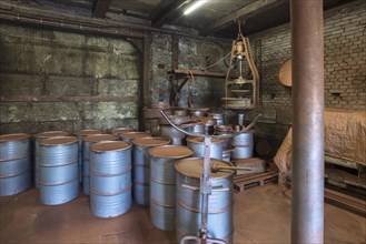 Barrels in a production room for bronze powder