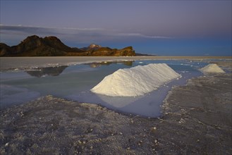 Salt piles during mining on the salt lake at dusk