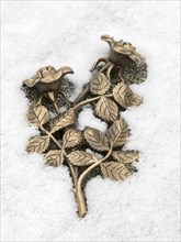 Metal rose in the snow