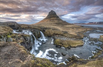 Kirkjufell mountain with Kirkjufellfoss waterfall at sunset