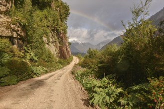 Gravel road with rainbow at Puerto Rio Tranquilo