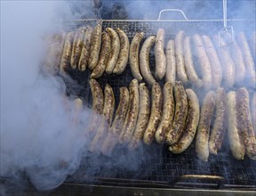 Grilled sausages wrapped in smoke