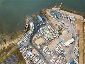 Aerial view of dry docks and shipyard with many boats in Olhao