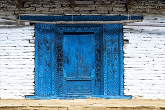 Blue old wooden carved door