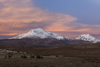 Volcano Parinacota with snow in the evening light