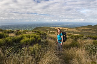 Hiker on the Pouakai Circuit Trail