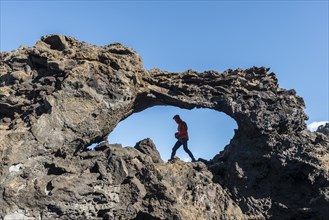 Man in a rock arch