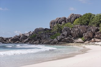 Grand Anse sandy beach with black granite rocks