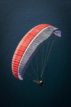 Paraglider over the Atlantic Ocean near La Caleta