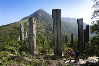 Hikers in front of wooden stelae at Wisdom Path