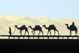 Camels as decoration on window