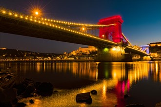 Illuminated chain bridge over the Danube at Blue Hour