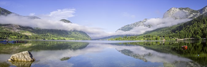 Panoramic view over the Grundlsee with low clouds