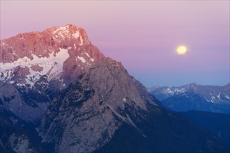 Zugspitze in the morning light with full moon