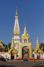 Monk in front of Chedi of Wat Phra That Phanom