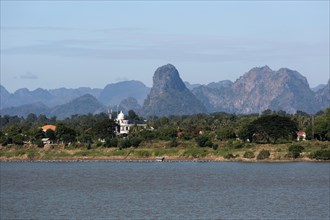 View over the border river Mekong to karst mountains in Laos