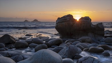 Stony coast at sunset