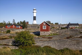 Red wooden houses with lighthouse