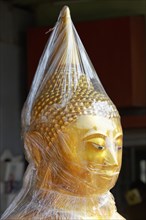 Buddha statue in foil