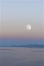 Moon rising over Song Kol lake