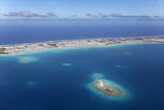 Island in the coral reef with clouds