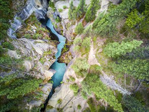 Mistaya Canyon with rich blue color water coming from icefields