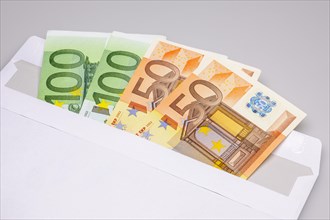 50 euro and 100 Euro banknotes in envelope