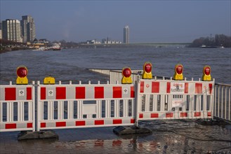 Barrier at a ship landing stage on the Rhine during flood
