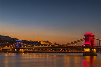 Illuminated chain bridge over the Danube at Blue Hour