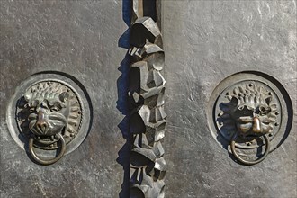 Lion heads as door knockers at the entrance portal of the Lorenzkirche