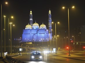 Traffic in front of illuminated Mohammed Al Ameen Mosque