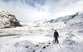 Hiker with ice pick on the glacier