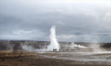 People watching the eruption of Geysir Strokkur