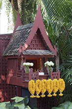 Thai mental house with floral decoration
