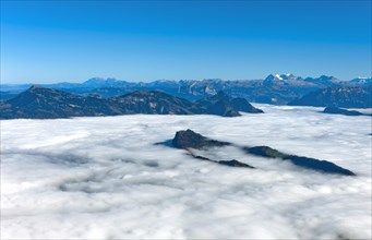 The Burgenstock rises from the sea of fog over Lake Lucerne