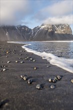 Stones at black sandy beach